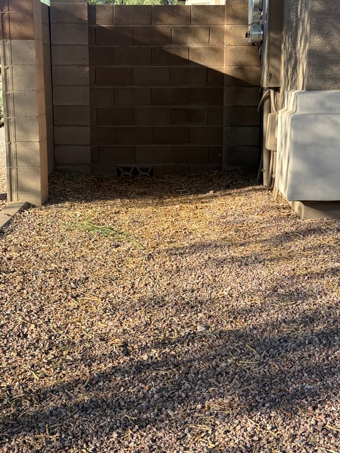 The same area cleared after the old artificial turf was removed and hauled away